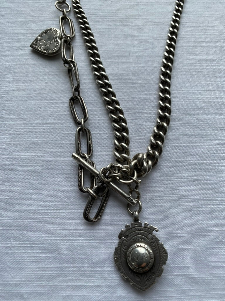 Brass Elizabeth Cole Necklace styled with Hardy Brothers sterling fob chain